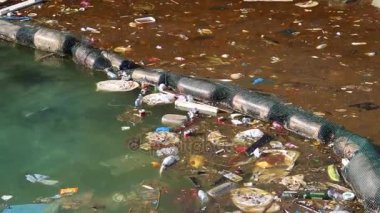 depositphotos_138498578-stock-video-garbage-floats-in-sea