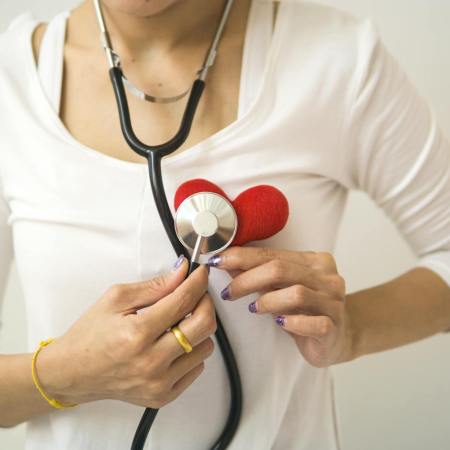 crop woman with stethoscope on neck