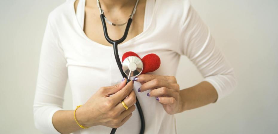 crop woman with stethoscope on neck