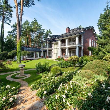 cottage exterior near garden with plants and pathways