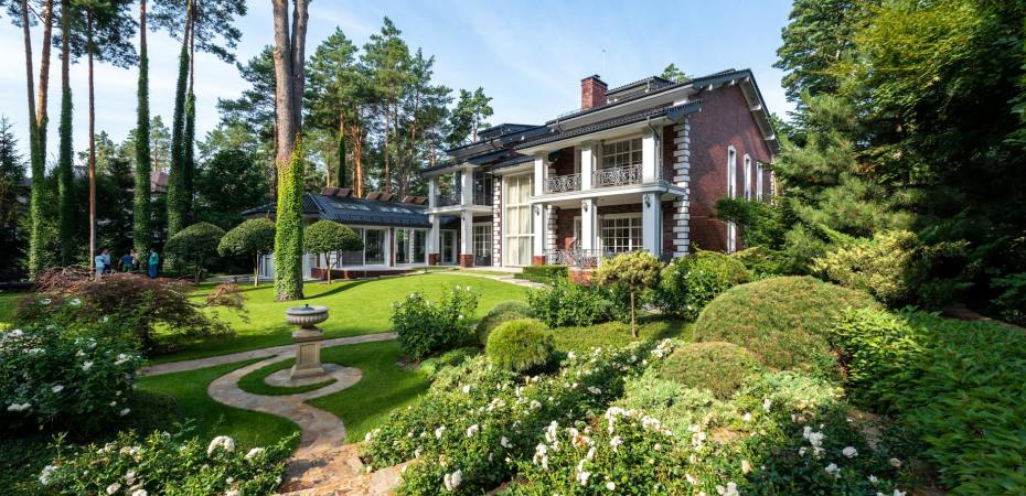 cottage exterior near garden with plants and pathways