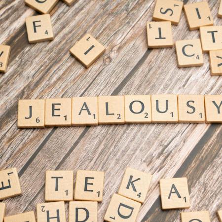 scrabble blocks forming jealousy word
