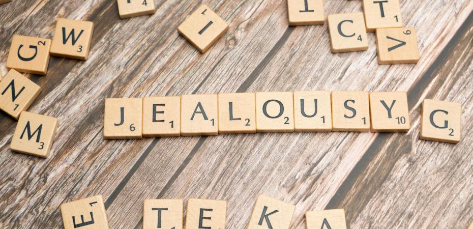 scrabble blocks forming jealousy word